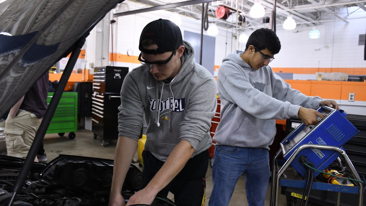 Students work on a car