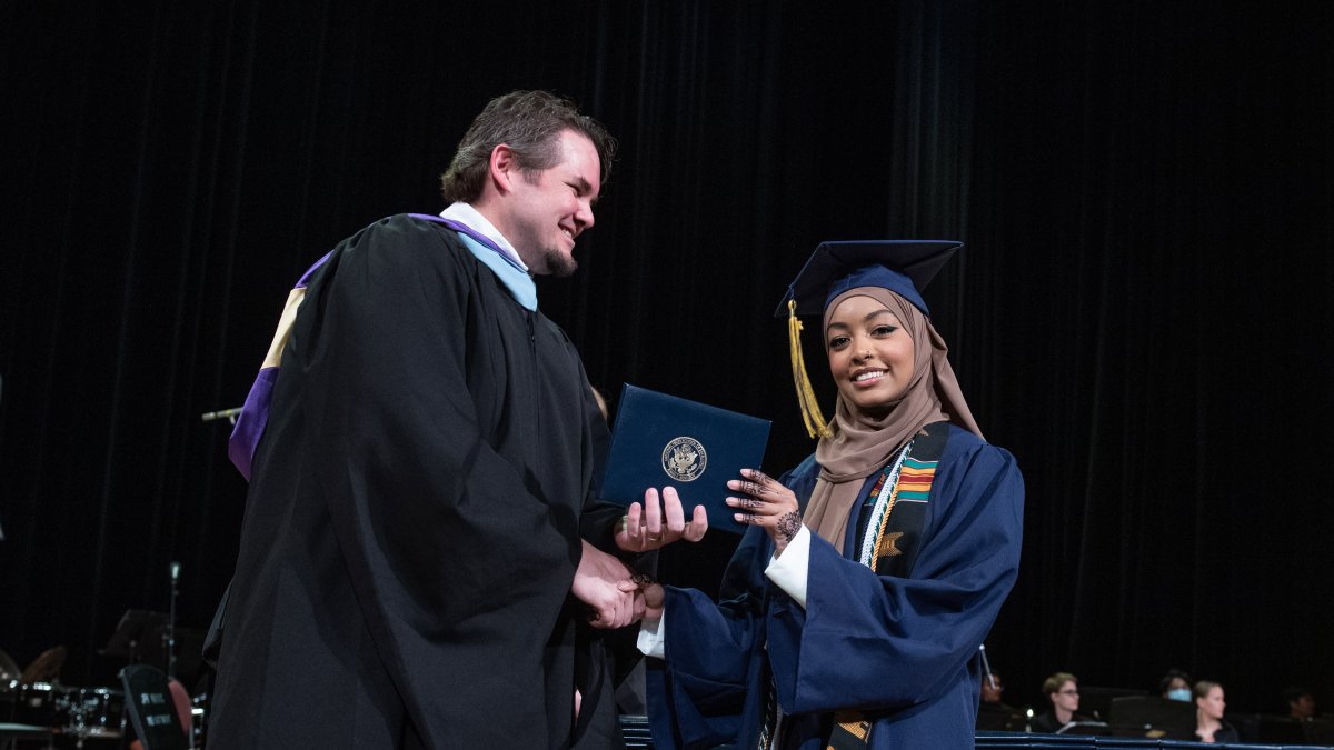student graduating receiving diploma