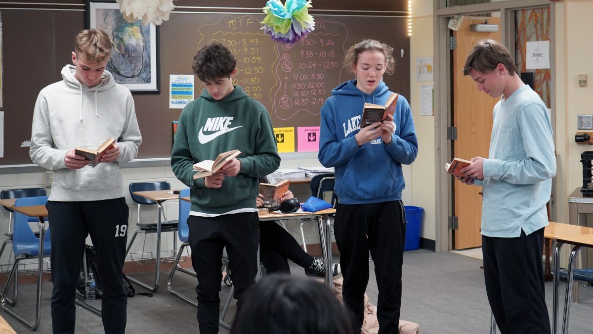 four students reading Hamlet