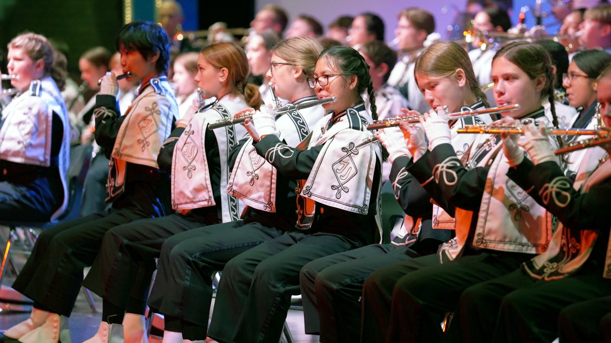 marching band students playing indoor concert