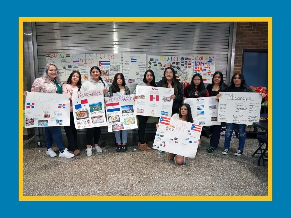 students holding posters about Hispanic countries
