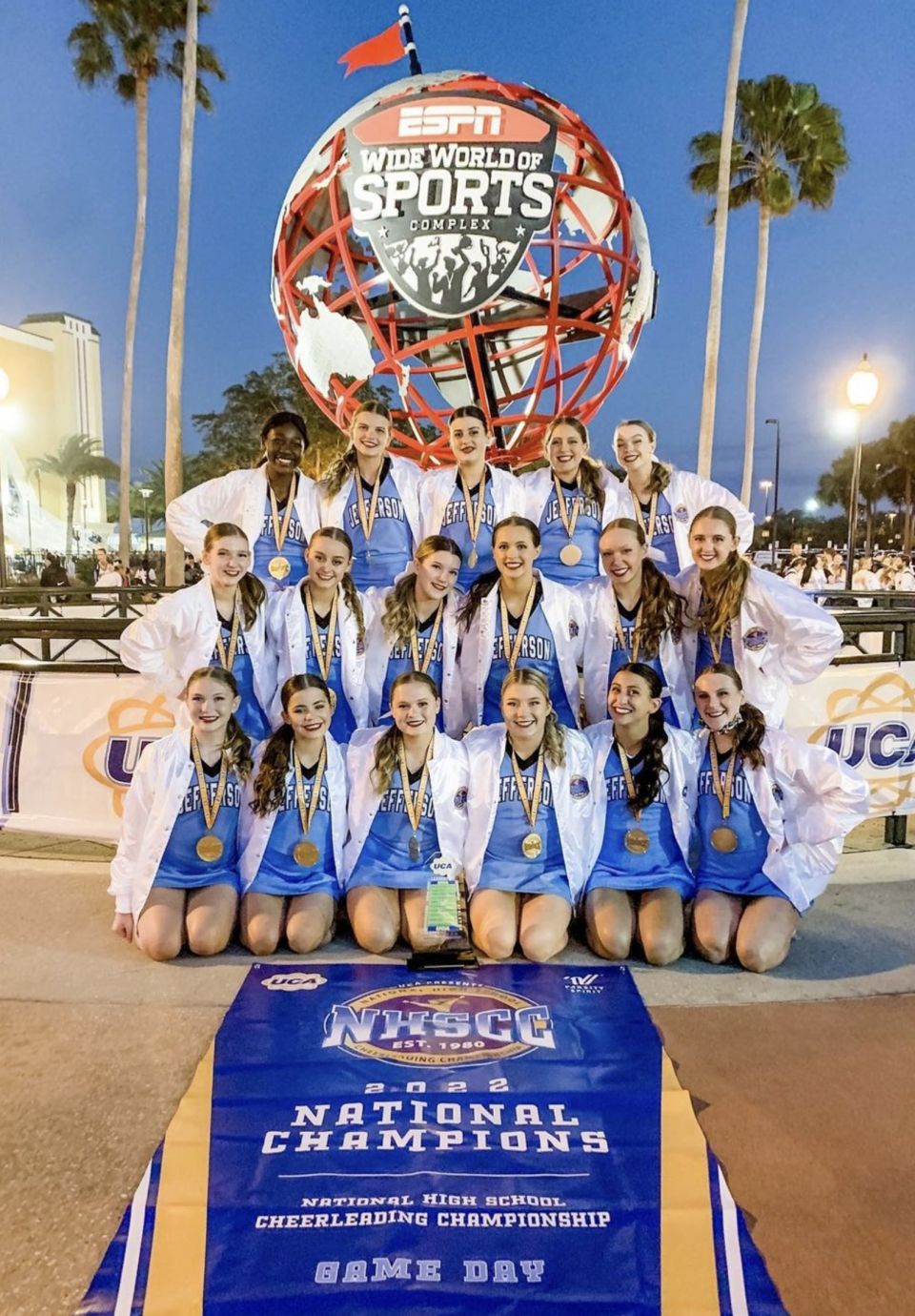 Photo of Bloomington Jefferson Cheer with National Championship banner