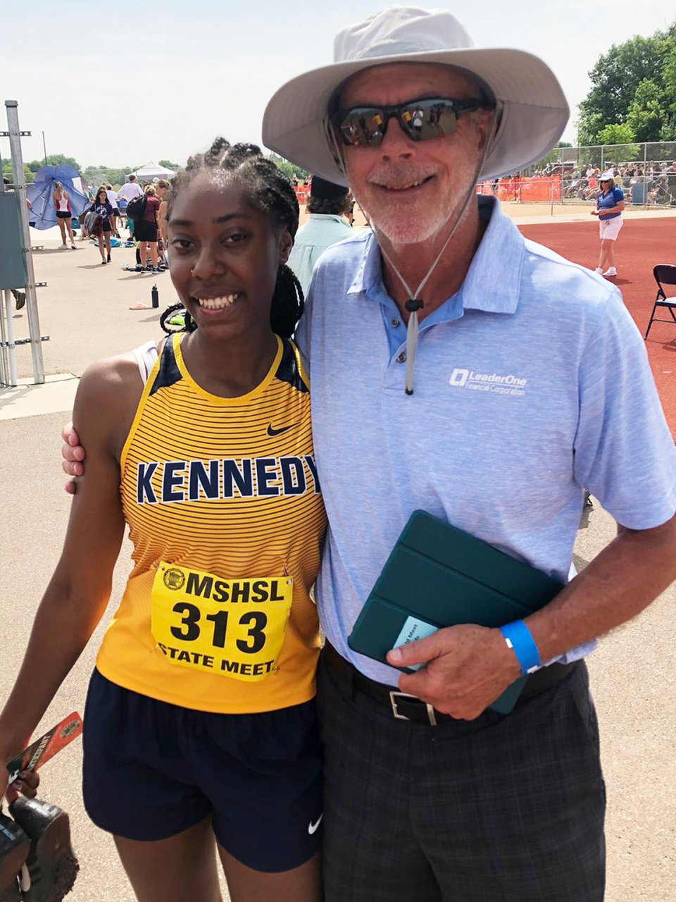 female Track and Field athlete with coach