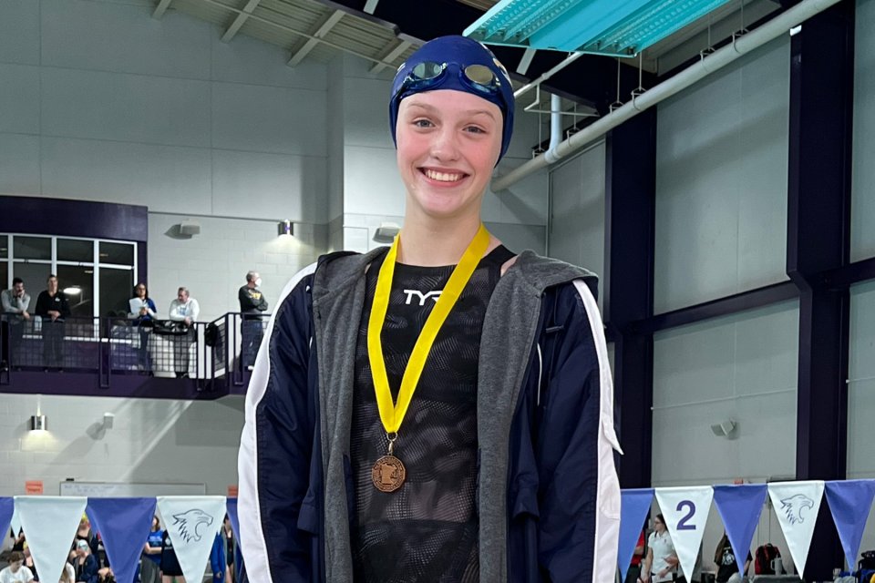 swimmer wearing a medal
